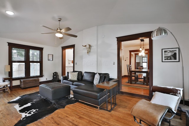 2663 Glen Echo Dr, Columbus, OH 43202 - living area featuring lofted ceiling, wood finished floors, ceiling fan, healthy amount of natural light, and baseboards