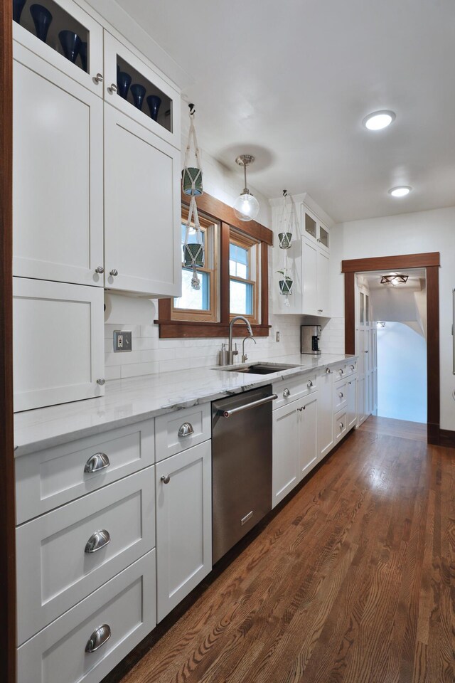 2663 Glen Echo Dr, Columbus, OH 43202 - kitchen featuring dishwasher, a sink, white cabinets, glass insert cabinets, and tasteful backsplash