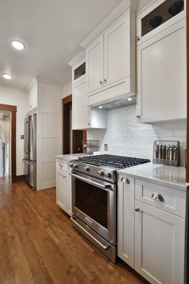 2663 Glen Echo Dr, Columbus, OH 43202 - kitchen featuring stainless steel appliances, white cabinetry, decorative backsplash, glass insert cabinets, and dark wood-style floors