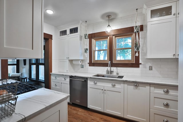 2663 Glen Echo Dr, Columbus, OH 43202 - kitchen featuring dishwasher, a sink, tasteful backsplash, and white cabinets