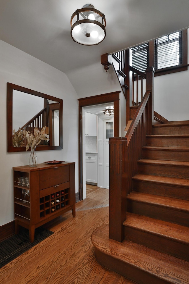 2663 Glen Echo Dr, Columbus, OH 43202 - staircase with wood finished floors and vaulted ceiling