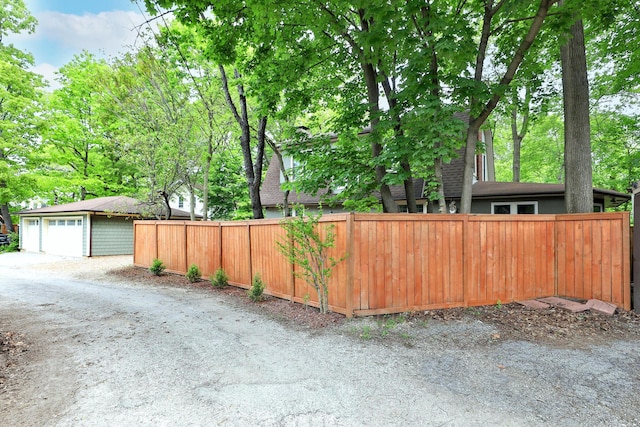 2663 Glen Echo Dr, Columbus, OH 43202 - view of yard featuring fence, a garage, and an outdoor structure