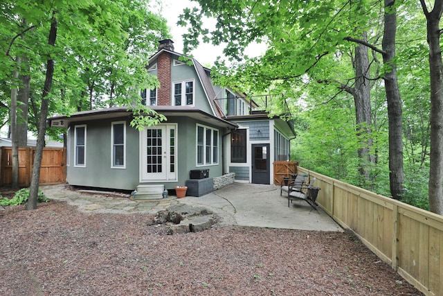 2663 Glen Echo Dr, Columbus, OH 43202 - rear view of property with a chimney, a patio, a fenced backyard, entry steps, and french doors