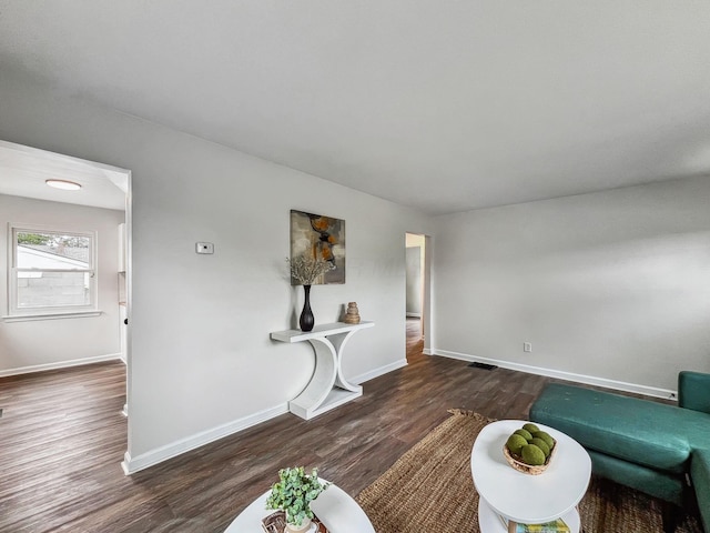 living room with wood finished floors and baseboards