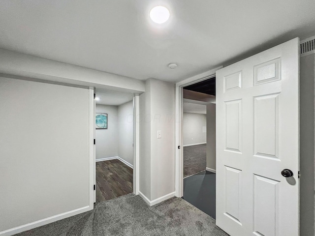 finished basement featuring carpet flooring and baseboards