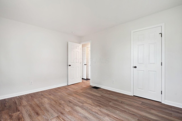 3476 Beulah Rd, Columbus, OH 43224 - unfurnished bedroom with wood finished floors and baseboards