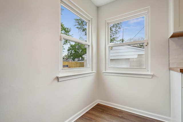 3476 Beulah Rd, Columbus, OH 43224 - unfurnished dining area featuring baseboards and dark wood finished floors