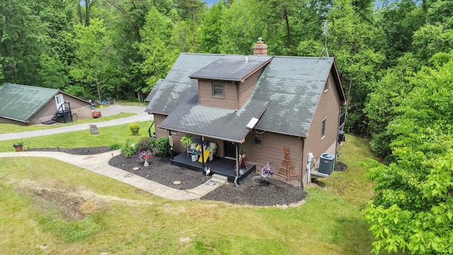 6334 Hansley Rd SE, Sugar Grove, OH 43155 - rear view of house with central AC, a chimney, a porch, a lawn, and a shingled roof