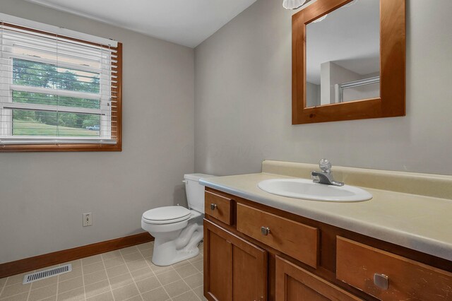 6334 Hansley Rd SE, Sugar Grove, OH 43155 - bathroom featuring toilet, vanity, and baseboards