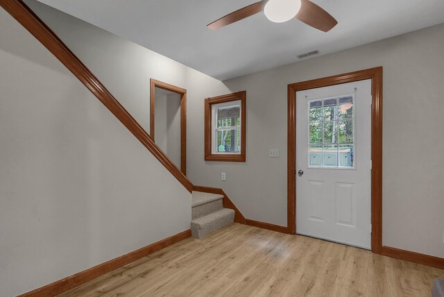 6334 Hansley Rd SE, Sugar Grove, OH 43155 - foyer with light wood finished floors, stairs, baseboards, and ceiling fan