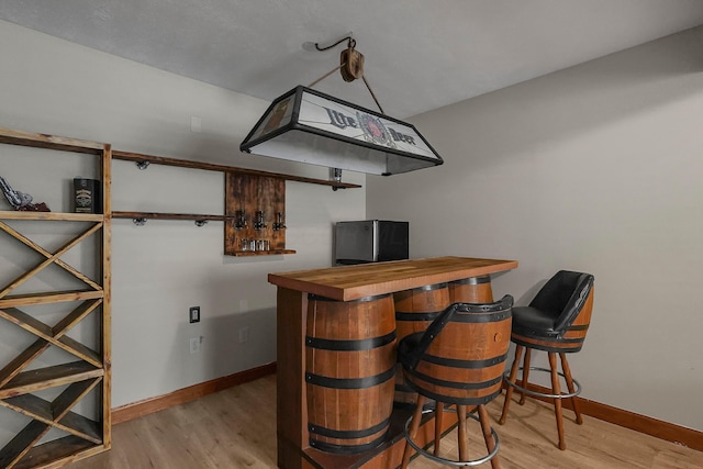 6334 Hansley Rd SE, Sugar Grove, OH 43155 - indoor dry bar with wood finished floors and baseboards
