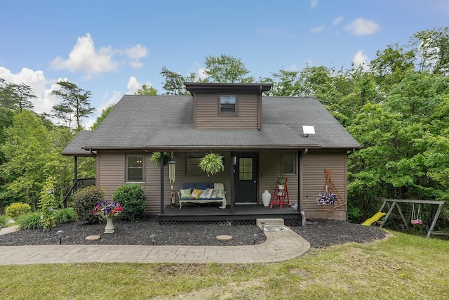 6334 Hansley Rd SE, Sugar Grove, OH 43155 - view of front of home with a front lawn, a playground, and covered porch