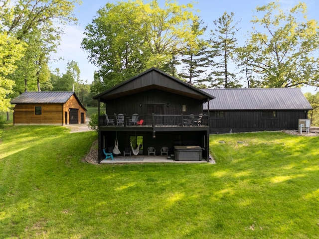 18156 Thompson Ridge Rd, Laurelville, OH 43135 - rear view of house with a yard, a deck, an outbuilding, and metal roof
