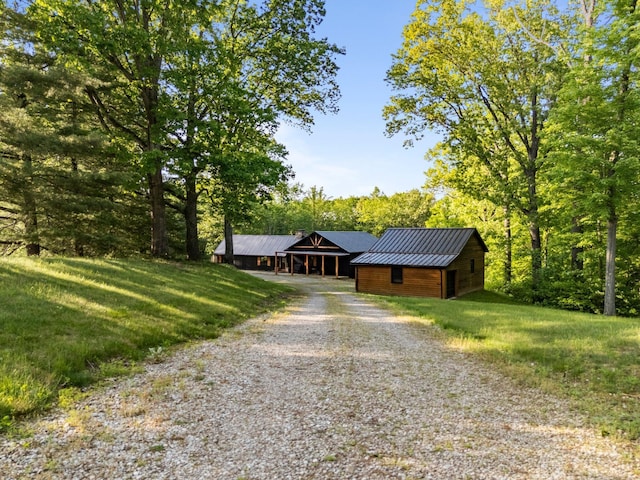 18156 Thompson Ridge Rd, Laurelville, OH 43135 - chalet / cabin with gravel driveway, a front yard, and metal roof