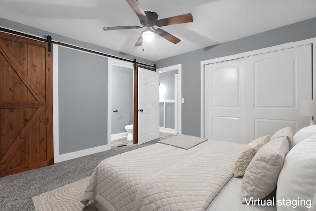 2433 Nedra St, Grove City, OH 43123 - bedroom with a barn door, carpet, ensuite bath, a closet, and ceiling fan