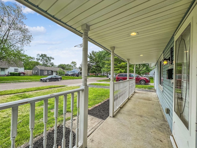 407 Yarmouth Ln, Columbus, OH 43228 - covered porch with a yard and a residential view