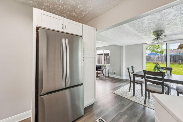 407 Yarmouth Ln, Columbus, OH 43228 - kitchen featuring freestanding refrigerator, white cabinetry, baseboards, ceiling fan, and dark wood-type flooring