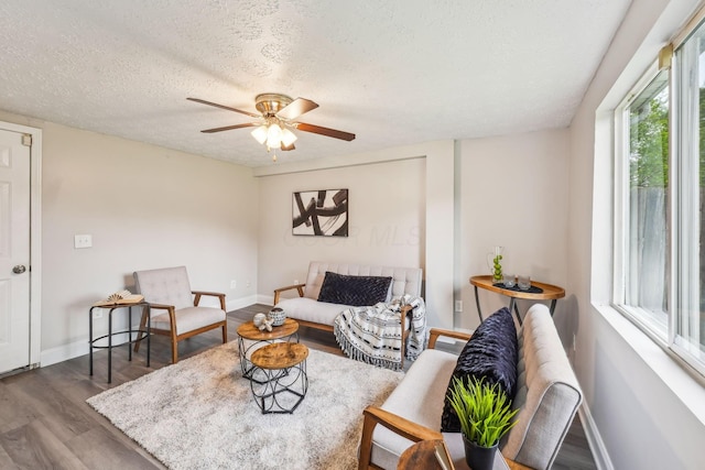 407 Yarmouth Ln, Columbus, OH 43228 - living area with wood finished floors, baseboards, a ceiling fan, and a textured ceiling