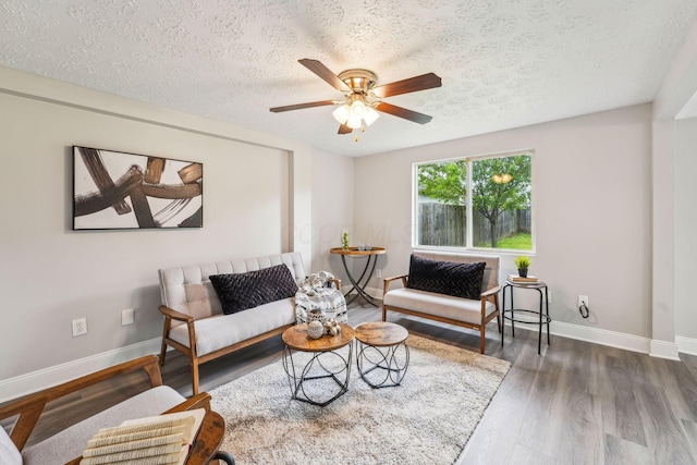 407 Yarmouth Ln, Columbus, OH 43228 - living room with baseboards, ceiling fan, wood finished floors, and a textured ceiling