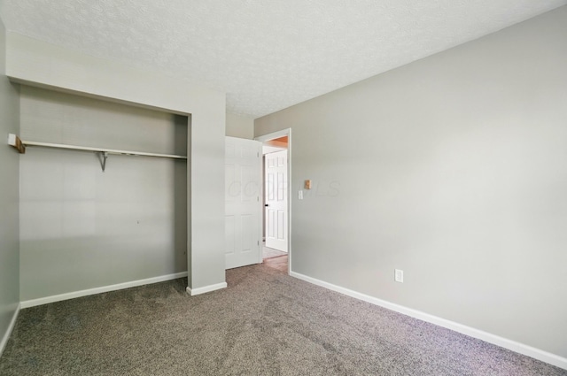 135 N Creekview Ct, Baltimore, OH 43105 - unfurnished bedroom with carpet flooring, baseboards, a closet, and a textured ceiling