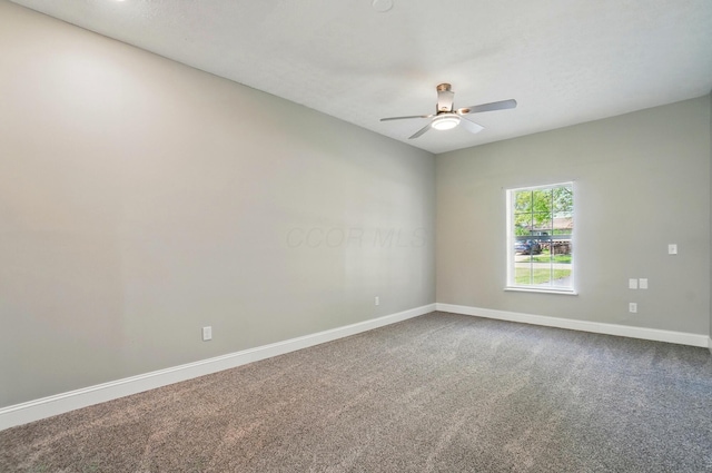 135 N Creekview Ct, Baltimore, OH 43105 - empty room featuring ceiling fan, baseboards, and dark colored carpet