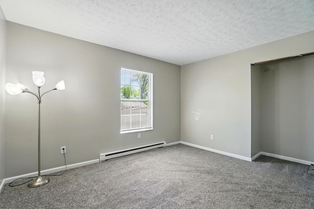 135 N Creekview Ct, Baltimore, OH 43105 - empty room with baseboard heating, carpet floors, baseboards, and a textured ceiling
