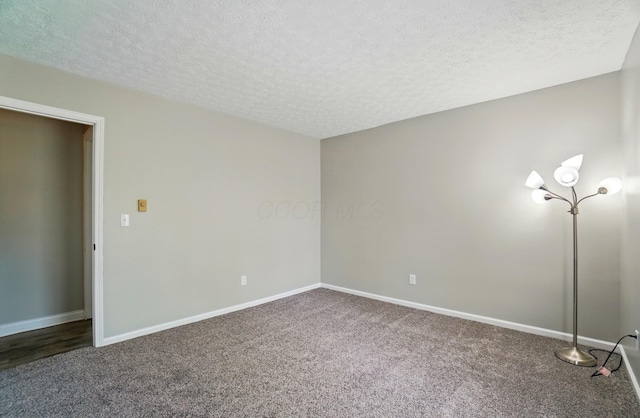 135 N Creekview Ct, Baltimore, OH 43105 - spare room featuring carpet floors, a textured ceiling, and baseboards