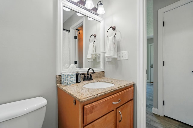135 N Creekview Ct, Baltimore, OH 43105 - full bathroom with toilet, wood finished floors, and vanity