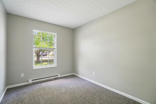 135 N Creekview Ct, Baltimore, OH 43105 - spare room featuring baseboard heating, carpet, baseboards, and a textured ceiling