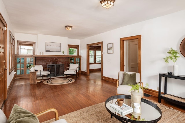 living area featuring wood finished floors and baseboards