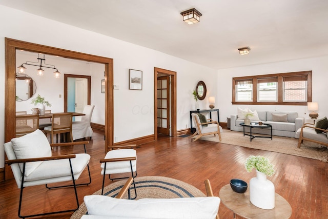 living room with wood finished floors and baseboards