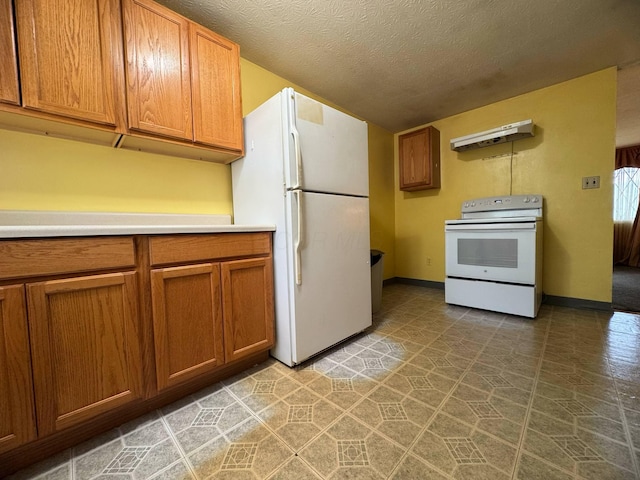 3457 Petzinger Rd, Columbus, OH 43232 - kitchen with white appliances, brown cabinetry, light countertops, under cabinet range hood, and baseboards