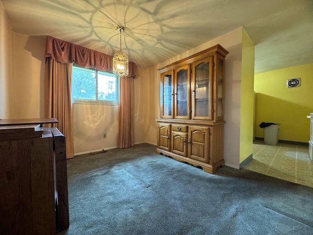 3457 Petzinger Rd, Columbus, OH 43232 - unfurnished dining area with carpet, a chandelier, and baseboards