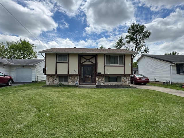 3457 Petzinger Rd, Columbus, OH 43232 - bi-level home featuring stone siding, driveway, stucco siding, and a front yard