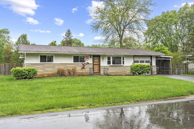 single story home featuring stone siding, asphalt driveway, stucco siding, and a carport