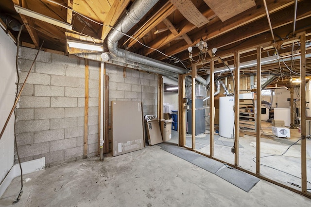 unfinished basement featuring washer / clothes dryer and water heater