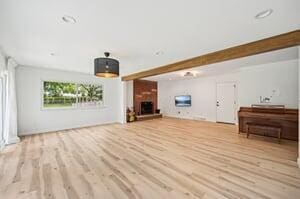 500 Cherrington Ct, Westerville, OH 43081 - unfurnished living room featuring a fireplace with raised hearth and wood finished floors