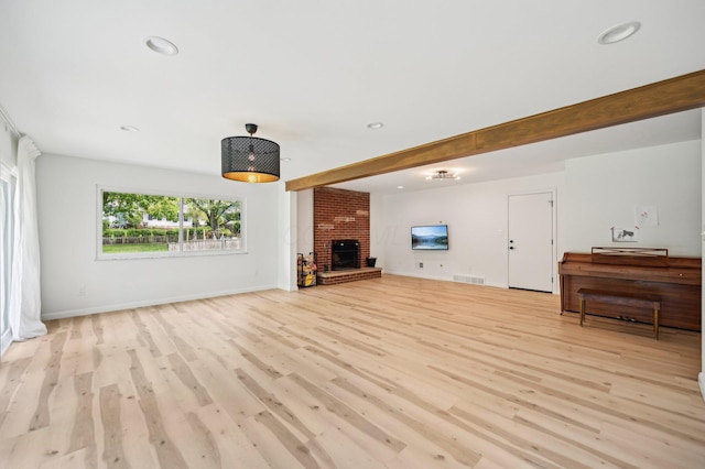 500 Cherrington Ct, Westerville, OH 43081 - unfurnished living room featuring light wood-type flooring, a brick fireplace, recessed lighting, baseboards, and beamed ceiling