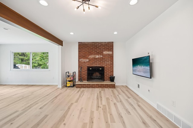 500 Cherrington Ct, Westerville, OH 43081 - unfurnished living room featuring wood finished floors, a fireplace, a chandelier, recessed lighting, and baseboards