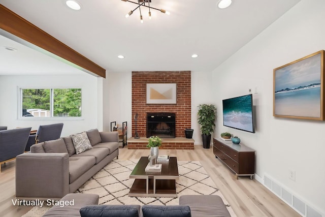 500 Cherrington Ct, Westerville, OH 43081 - living area featuring light wood-style flooring, a chandelier, recessed lighting, and a fireplace