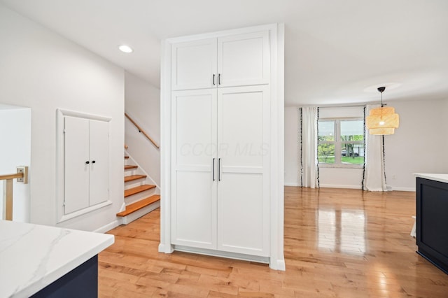 500 Cherrington Ct, Westerville, OH 43081 - kitchen with light stone counters, recessed lighting, light wood finished floors, white cabinetry, and pendant lighting