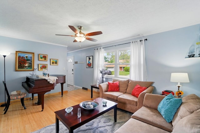 5508 Aspen Rd, Columbus, OH 43229 - living area featuring a ceiling fan, light wood finished floors, crown molding, baseboards, and a textured ceiling