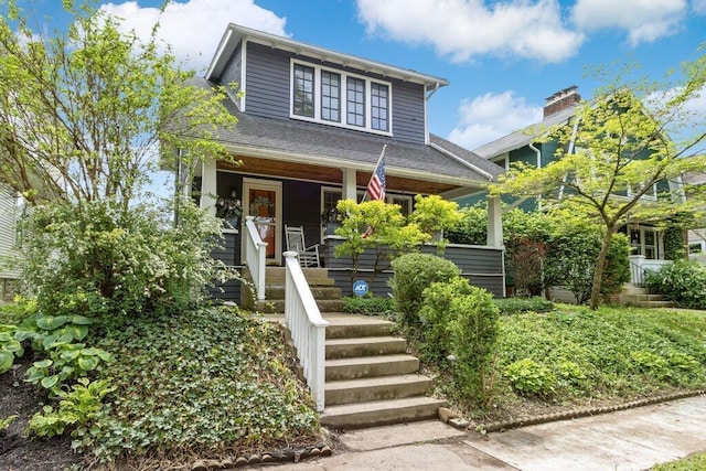 view of front of home featuring a porch and stairs