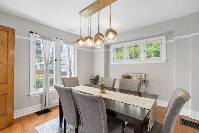 dining space featuring healthy amount of natural light and baseboards