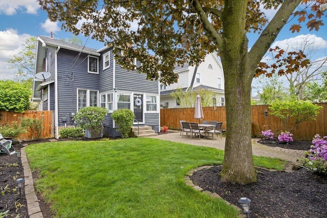rear view of house featuring a patio