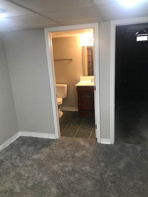 1817 Ridgebury Dr, Hilliard, OH 43026 - bathroom with toilet, vanity, and baseboards