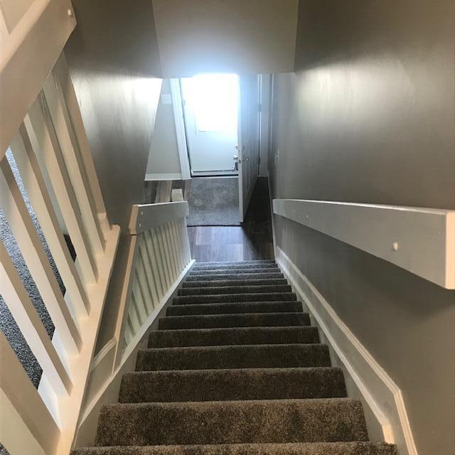 1817 Ridgebury Dr, Hilliard, OH 43026 - staircase with wood finished floors and baseboards
