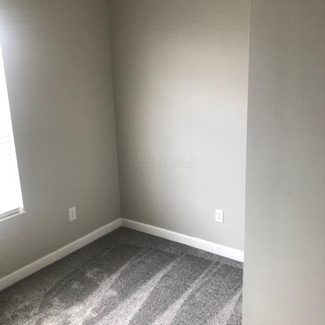 1817 Ridgebury Dr, Hilliard, OH 43026 - spare room featuring dark colored carpet and baseboards