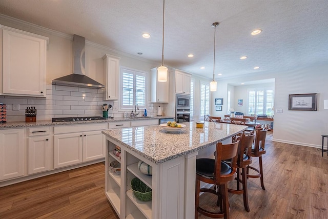 6210 Callaway Sq W, New Albany, OH 43054 - kitchen with wall chimney exhaust hood, appliances with stainless steel finishes, a sink, white cabinets, and dark wood-style flooring