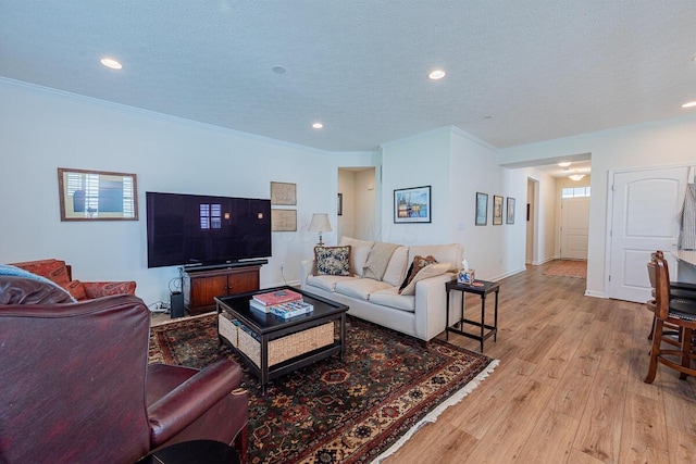 6210 Callaway Sq W, New Albany, OH 43054 - living room with crown molding, wood finished floors, recessed lighting, a textured ceiling, and baseboards